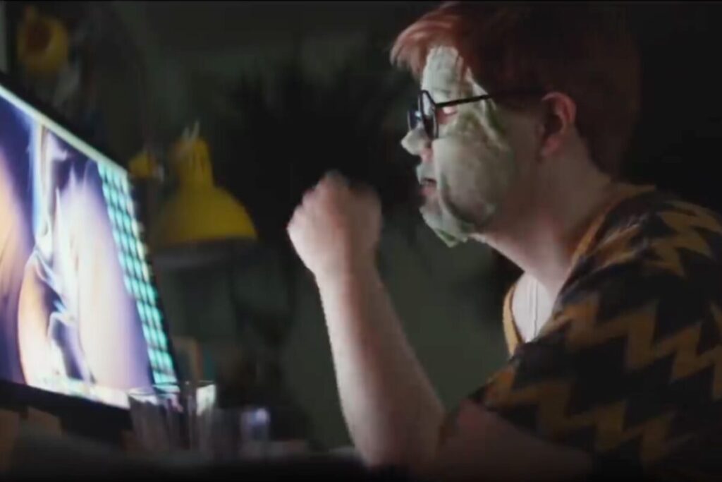 Person with face mask working late at computer in Apple Remote Work ad