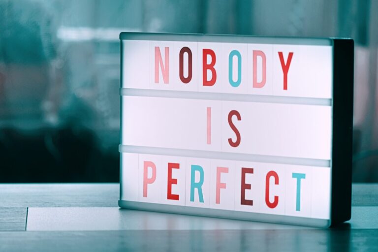 Lightbox sign with the words “Nobody Is Perfect,” representing self-acceptance and the themes of The Gifts of Imperfection audiobook.